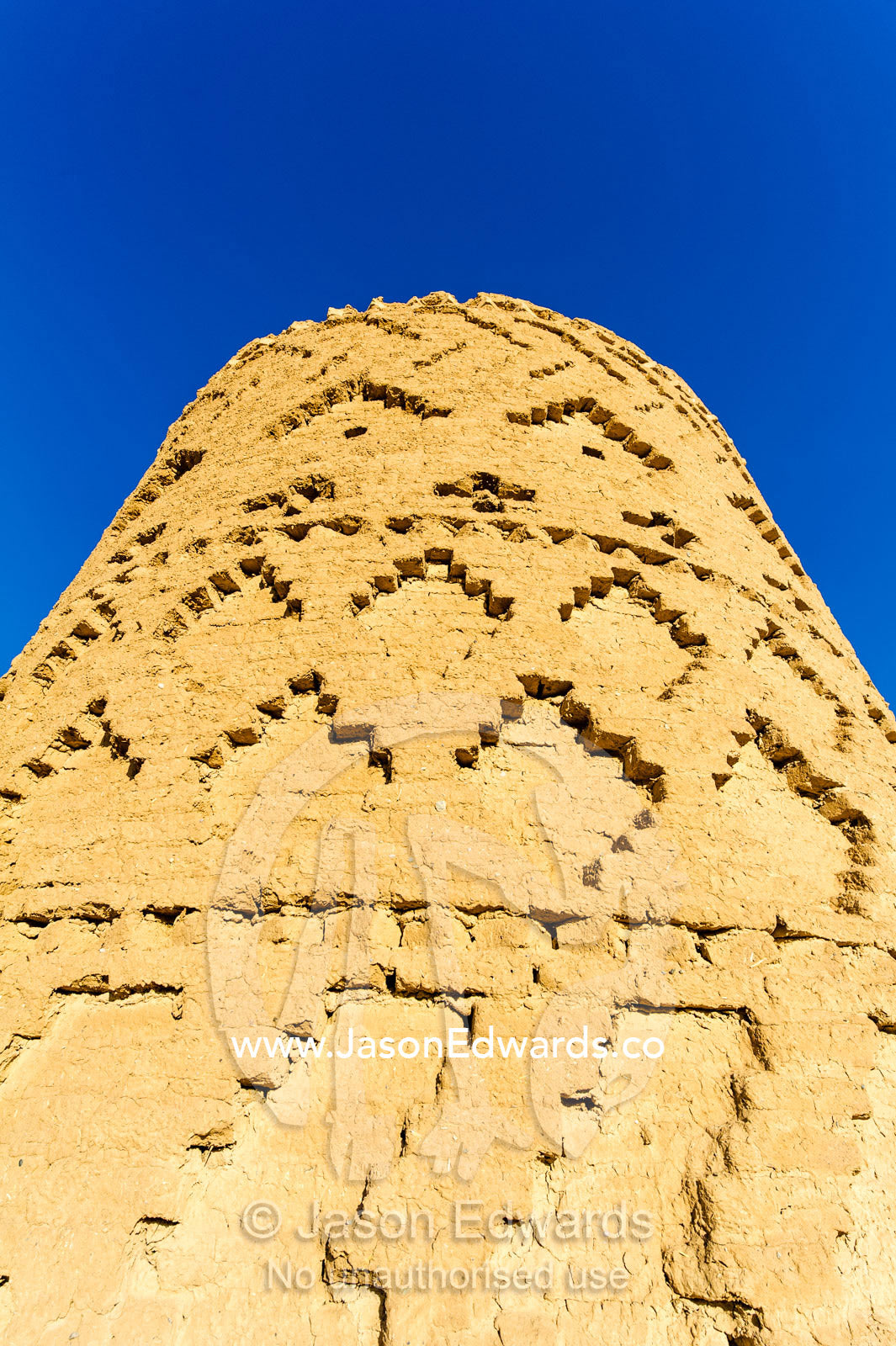 An ancient mud brick watch tower in a desert fortress. Narin Castle, Meybod, Meybod County, Yazd Province, Islamic Republic of Iran.