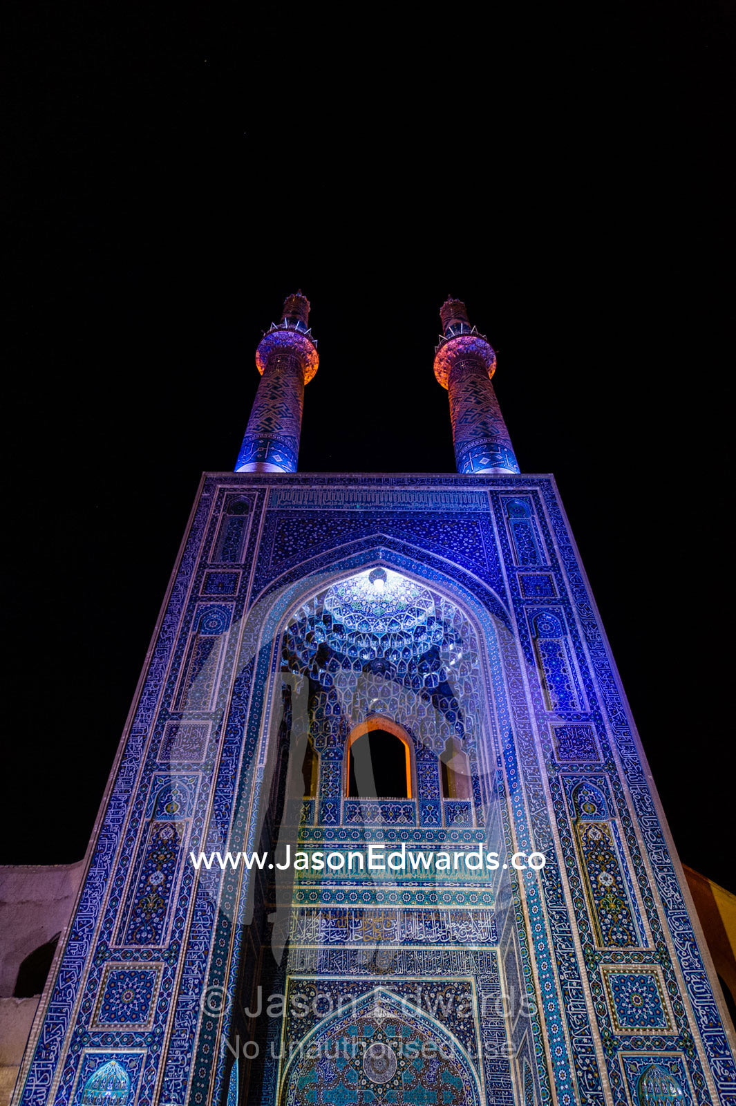 The iridescent blue minarets above the vaulted iwan to the Jame Mosque. Jame Mosque of Yazd, Yazd, Yazd Province, Islamic Republic of Iran.