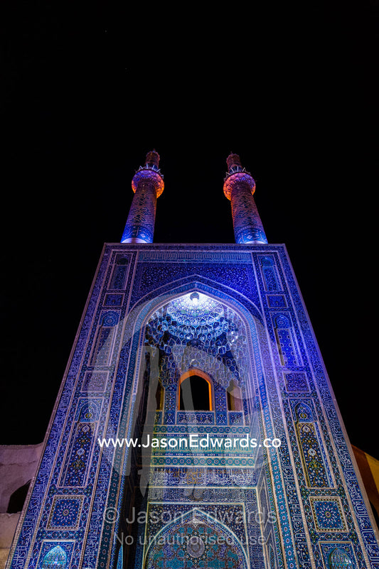 The iridescent blue minarets above the vaulted iwan to the Jame Mosque. Jame Mosque of Yazd, Yazd, Yazd Province, Islamic Republic of Iran.