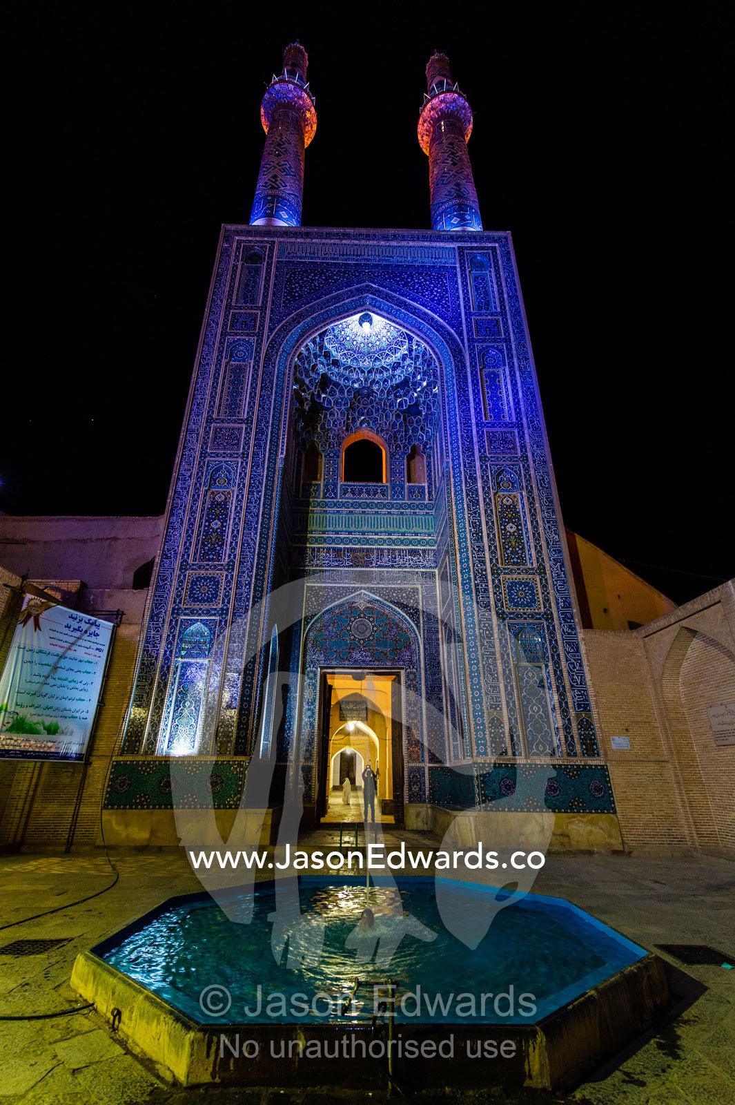 The iridescent blue minarets above the vaulted iwan pond to the Jame Mosque. Jame Mosque of Yazd, Yazd, Yazd Province, Islamic Republic of Iran.