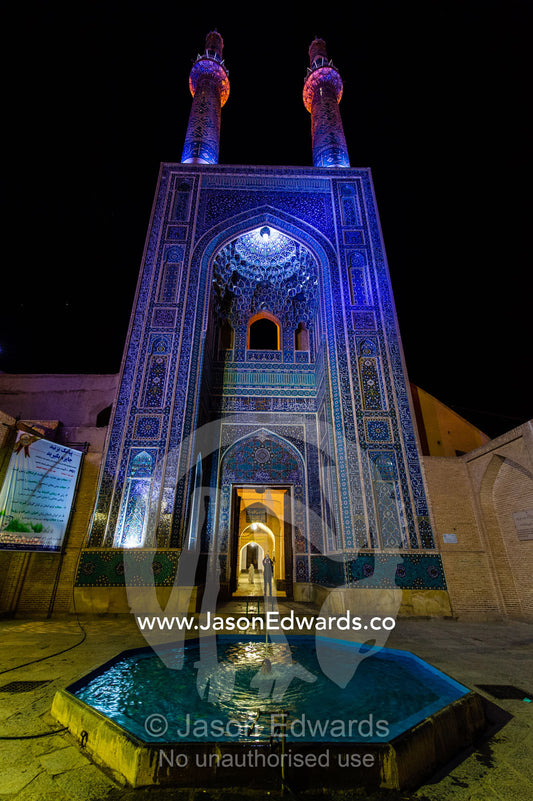 The iridescent blue minarets above the vaulted iwan pond to the Jame Mosque. Jame Mosque of Yazd, Yazd, Yazd Province, Islamic Republic of Iran.