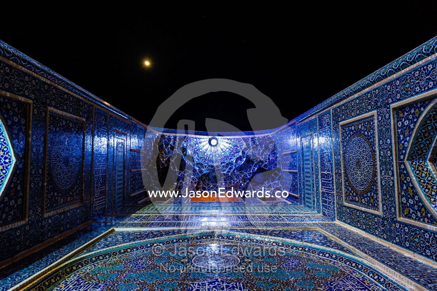 Looking up beneath the iridescent blue minarets above the vaulted iwan to the Jame Mosque. Jame Mosque of Yazd, Yazd, Yazd Province, Islamic Republic of Iran.