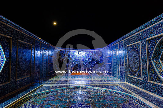 Looking up beneath the iridescent blue minarets above the vaulted iwan to the Jame Mosque. Jame Mosque of Yazd, Yazd, Yazd Province, Islamic Republic of Iran.