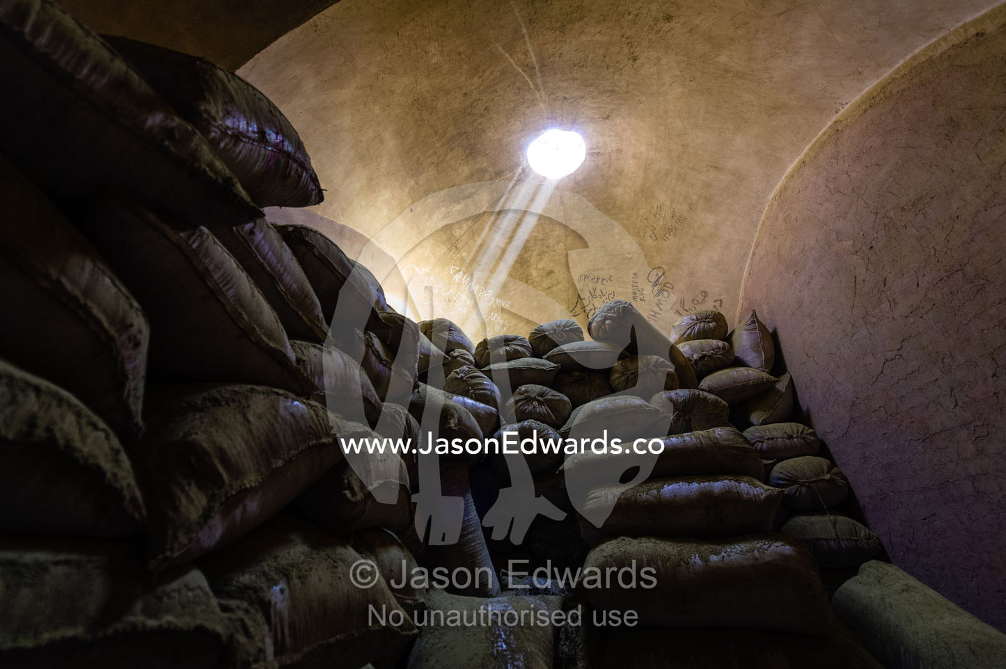 Sunrays touch bags of henna powder stored in an ancient henna mill. Yazd, Yazd Province, Islamic Republic of Iran.