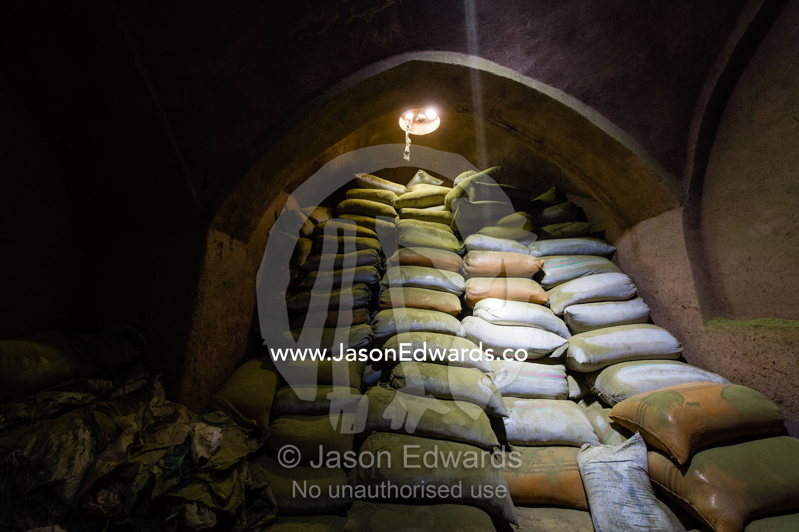 Sunrays touch bags of henna powder stored in an ancient henna mill. Yazd, Yazd Province, Islamic Republic of Iran.