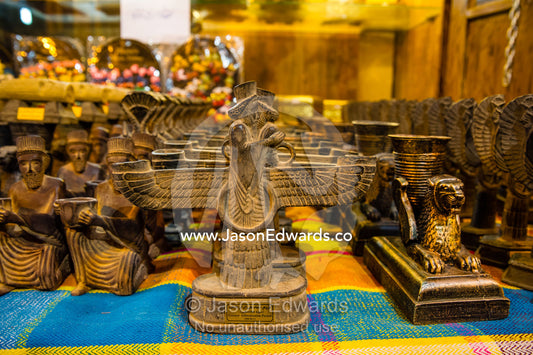 A statue of Faravahar is a religious-cultural symbol for sale in a bazaar. Vakil Bazaar, Shiraz, Islamic Republic of Iran.