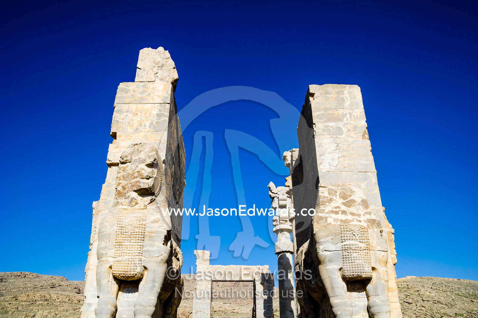 Towering protective gods known as Lamassu at the Gate of All Nations in Persepolis. Persepolis, Shiraz, Fars Province, Islamic Republic of Iran.