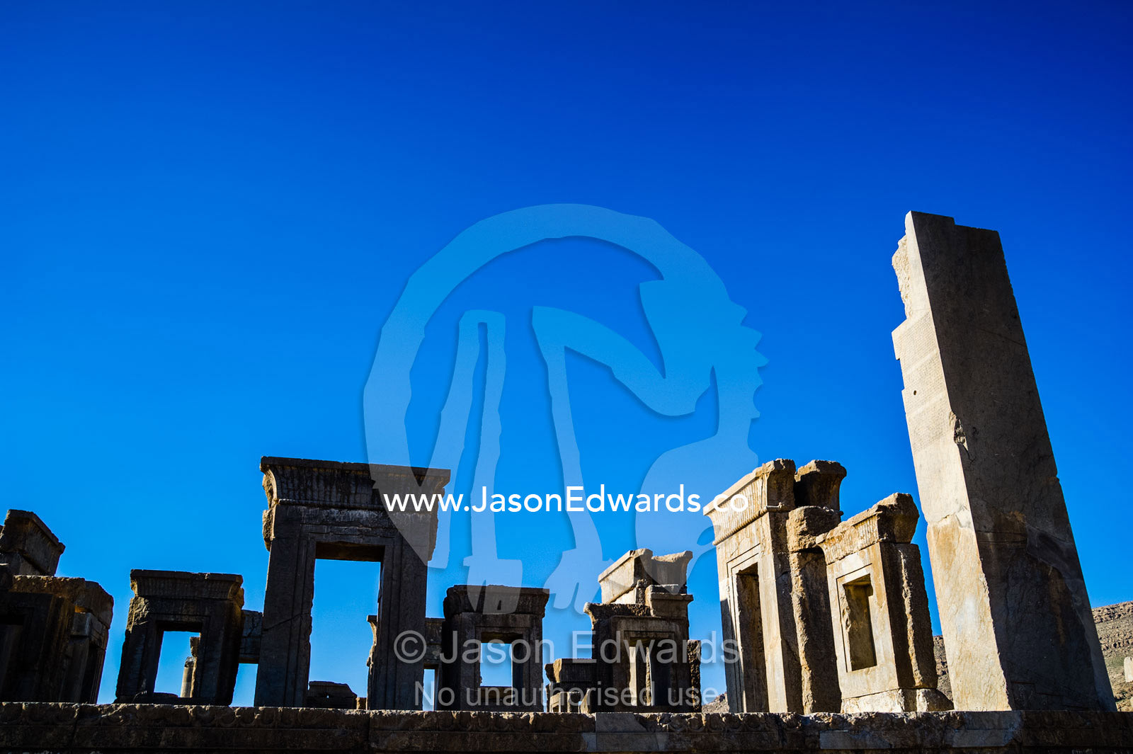The towering columns, doorways and lintels of the Tachara Palace. Persepolis, Shiraz, Fars Province, Islamic Republic of Iran.