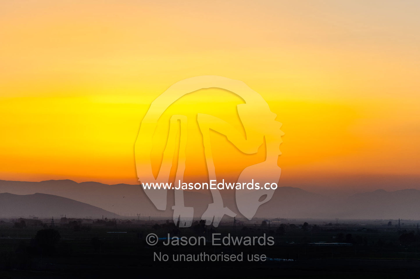 The sunset afterglow falls over the plain at Persepolis. Persepolis, Shiraz, Fars Province, Islamic Republic of Iran.