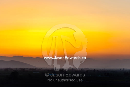 The sunset afterglow falls over the plain at Persepolis. Persepolis, Shiraz, Fars Province, Islamic Republic of Iran.