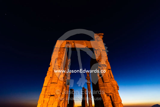 Towering protective gods known as Lamassu at the Gate of All Nations in Persepolis at sunset. Persepolis, Shiraz, Fars Province, Islamic Republic of Iran.