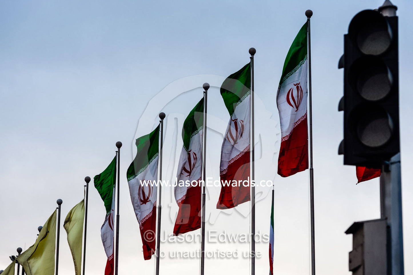 A row of Iranian flags fluttering in the breeze. Tehran, Tehran Province, Islamic Republic of Iran.