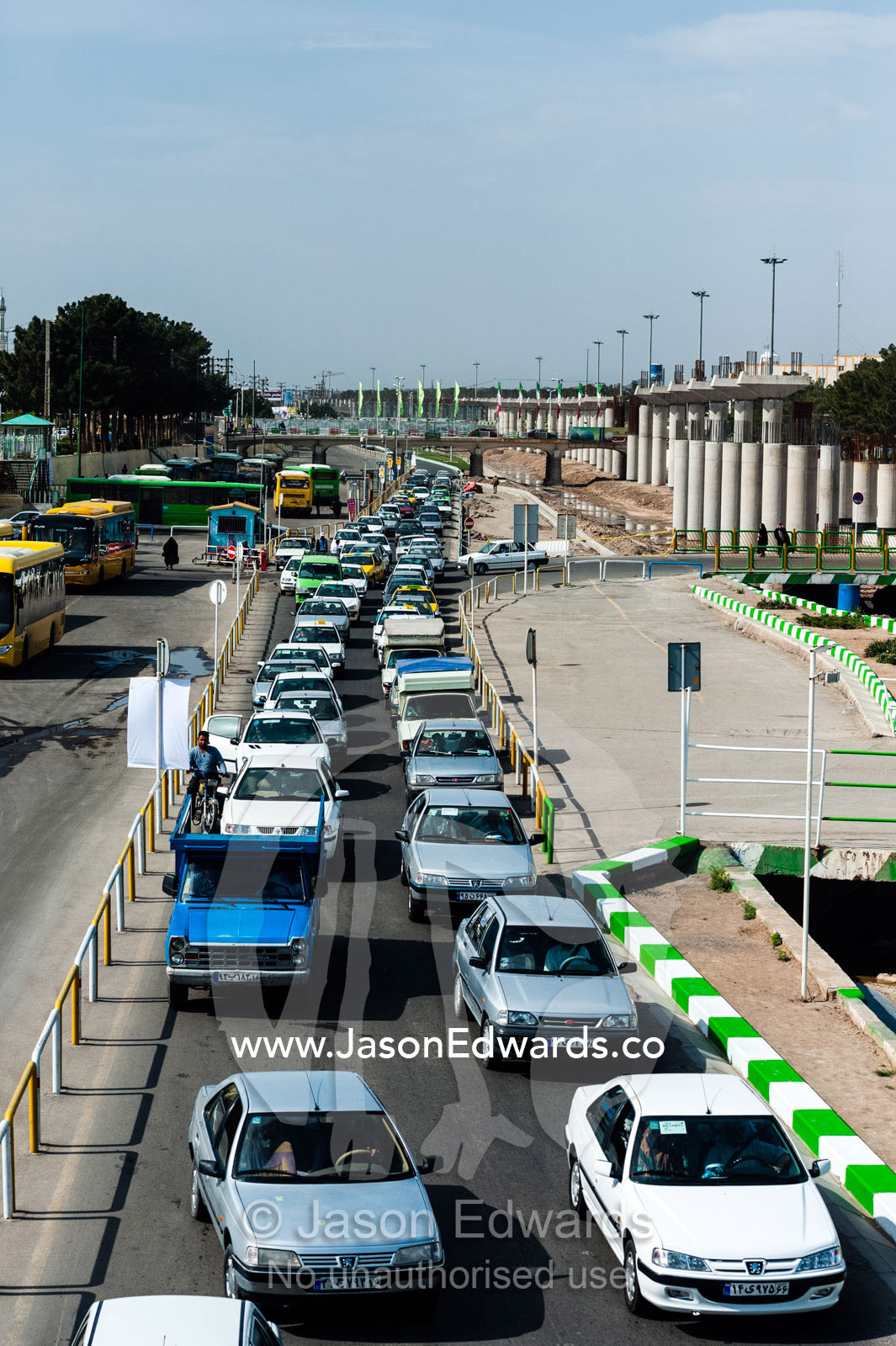 Traffic congestion leading into a city during the holiday season. Qom, Qom Province, Islamic Republic of Iran.