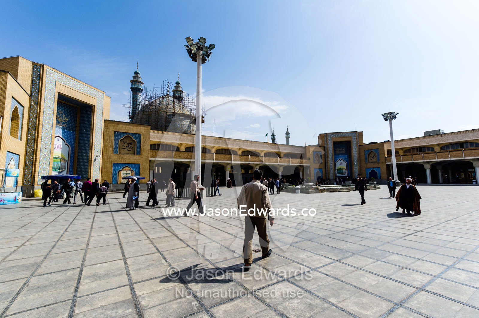 Men walking to prayer through the courtyard of the Holy shrine of Hazrat Masuma. Fatima Masumeh Shrine, Qom, Qom Province, Islamic Republic of Iran.