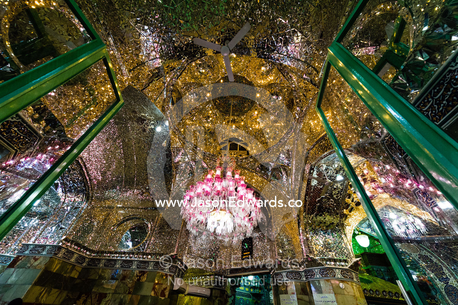 Light from the chandelier reflecting in all directions from the magnificent mirrored ceiling of the Holy shrine of Hazrat Masuma. Fatima Masumeh Shrine, Qom, Qom Province, Islamic Republic of Iran.