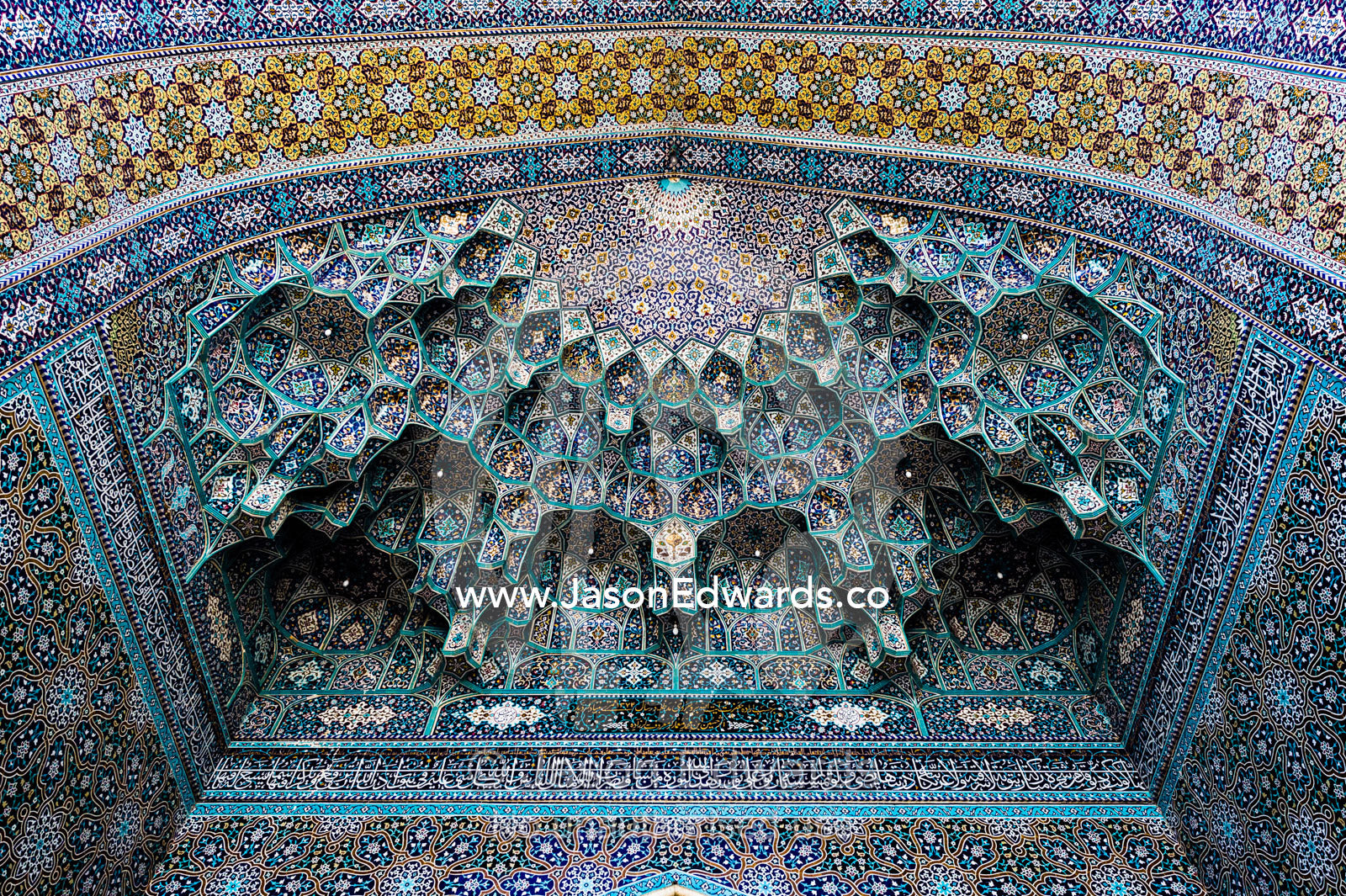 The intricate tiled muqarnas on the vaulted surface of the Holy shrine of Hazrat Masuma. Fatima Masumeh Shrine, Qom, Qom Province, Islamic Republic of Iran.