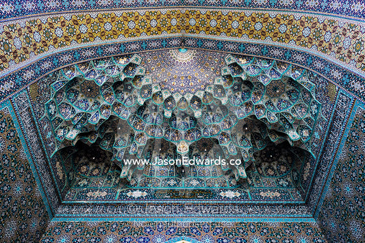 The intricate tiled muqarnas on the vaulted surface of the Holy shrine of Hazrat Masuma. Fatima Masumeh Shrine, Qom, Qom Province, Islamic Republic of Iran.