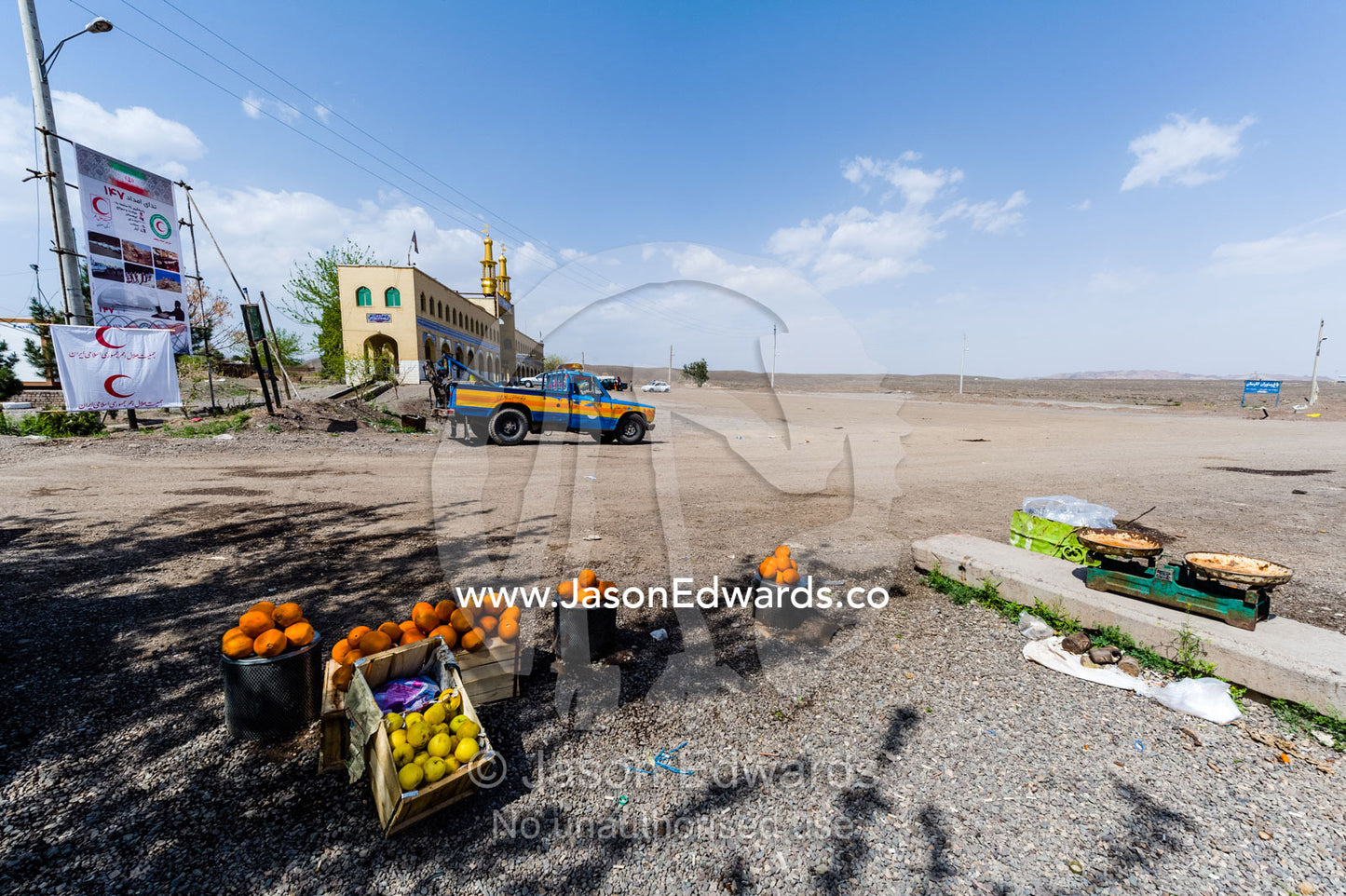 A roadside stall in the desert selling citrus fruit. Kashan County, Isfahan Province, Islamic Republic of Iran.