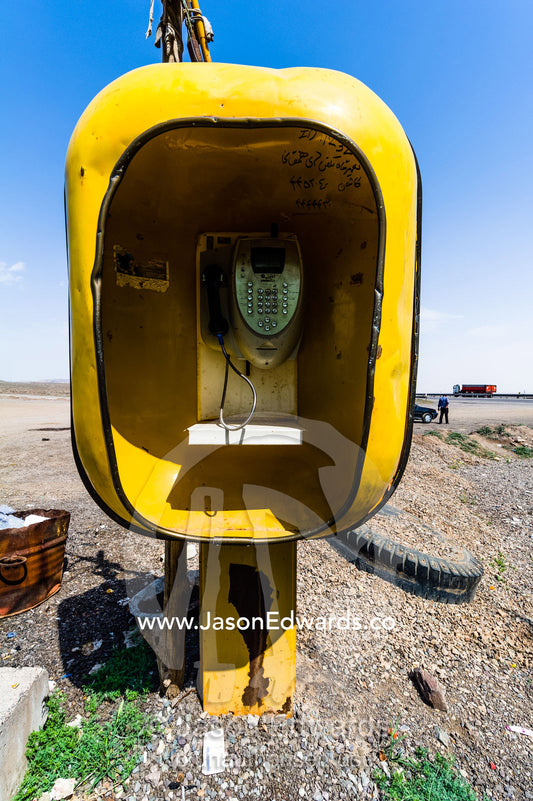 A well used public phone booth in the desert. Kashan County, Isfahan Province, Islamic Republic of Iran.