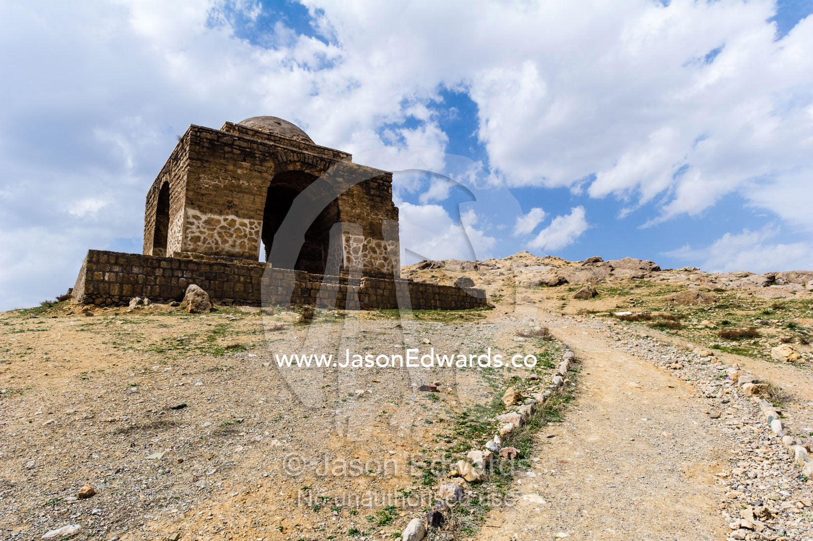 A path leads up a mountain side to an ancient fire temple. Niasar, Neyasar District, Kashan County, Isfahan Province, Islamic Republic of Iran.