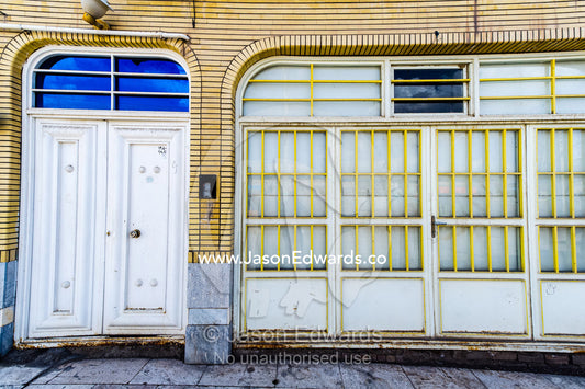 Steel bars protect the windows in an arched garage doorway. Niasar, Neyasar District, Kashan County, Isfahan Province, Islamic Republic of Iran.