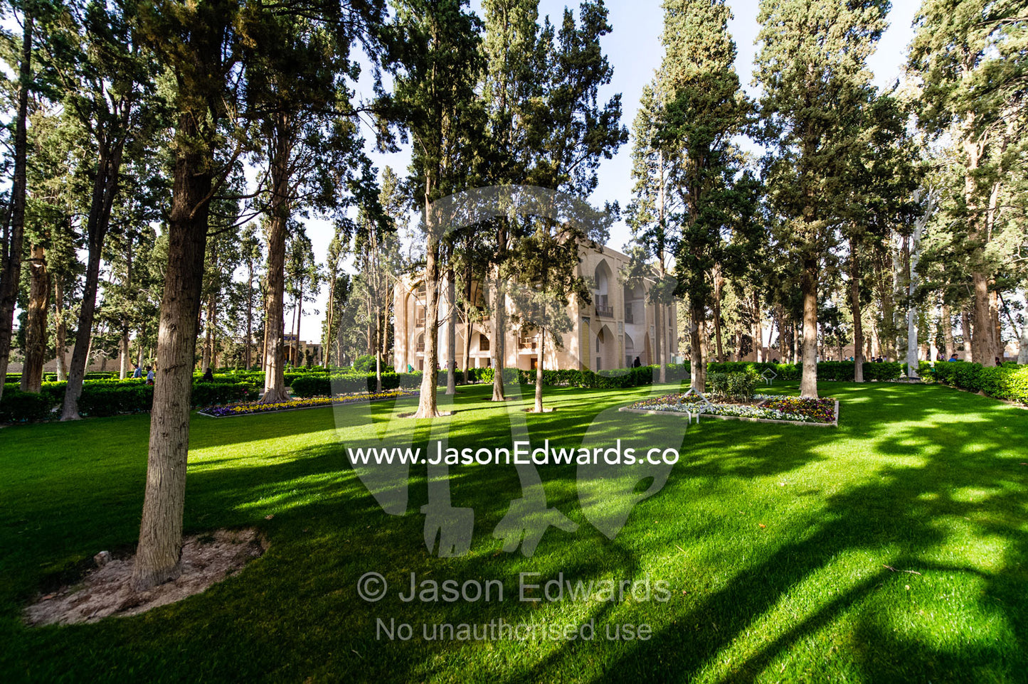 Manicured lawns and rows of trees in an historical Persian garden. Fin Garden, Kashan, Isfahan, Islamic Republic of Iran.