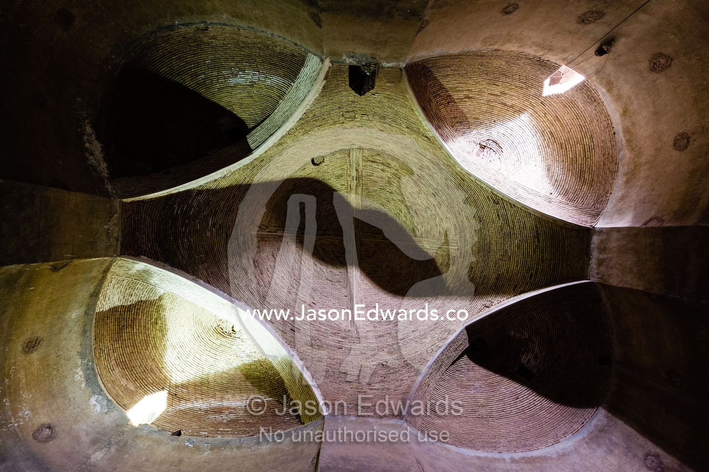 The towering brick walls and domed ceilings of an ancient grainery. Kashan, Isfahan, Islamic Republic of Iran.