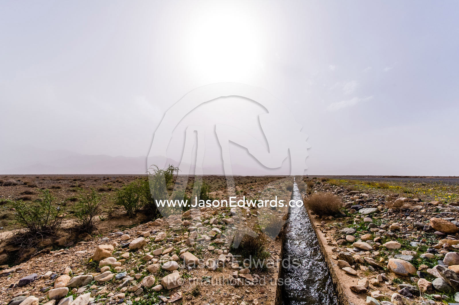 An aqueduct known as a falaj transports water across a barren desert. Barzrud Rural District, Natanz County, Isfahan Province, Islamic Republic of Iran.