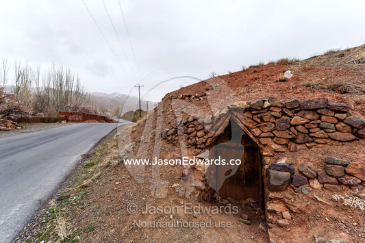 Caves dug into a hillside to shelter sheep during the mountain winters. Abyaneh, Barzrud Rural District, Natanz County, Isfahan Province, Islamic Republic of Iran.
