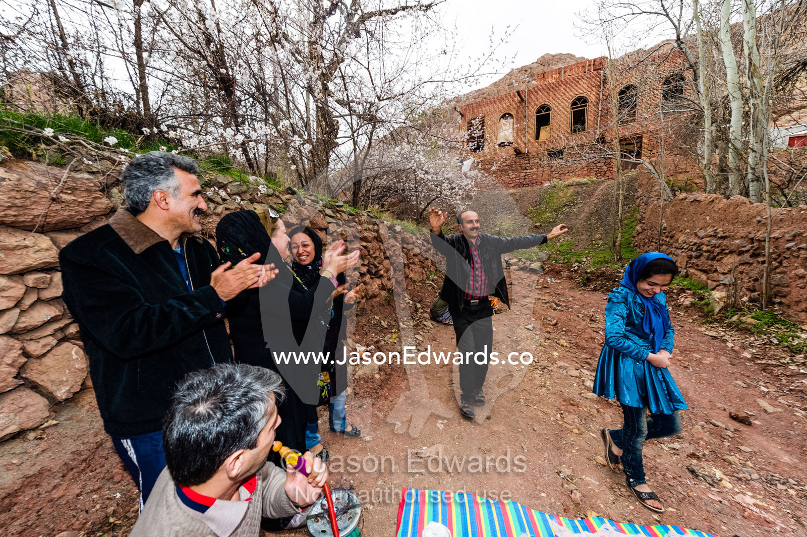 A family dances in a mountain village to celebrate the New Year. Abyaneh Village, Abyaneh, Barzrud Rural District, Natanz County, Isfahan Province, Islamic Republic of Iran.