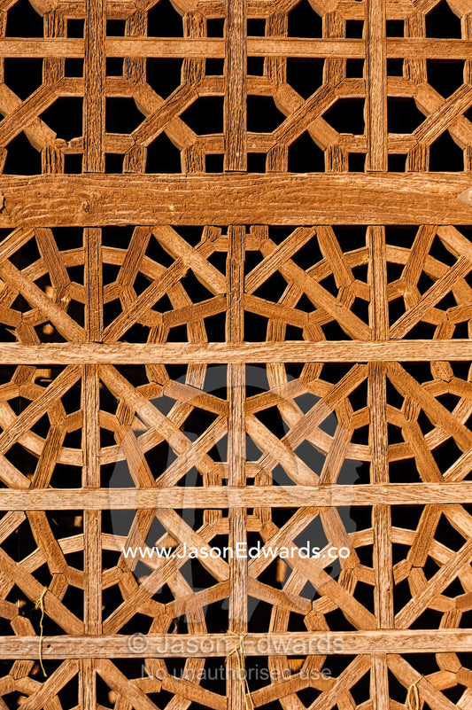 A carved timber lattice screen covers a window opening. Abyaneh Village, Abyaneh, Barzrud Rural District, Natanz County, Isfahan Province, Islamic Republic of Iran.