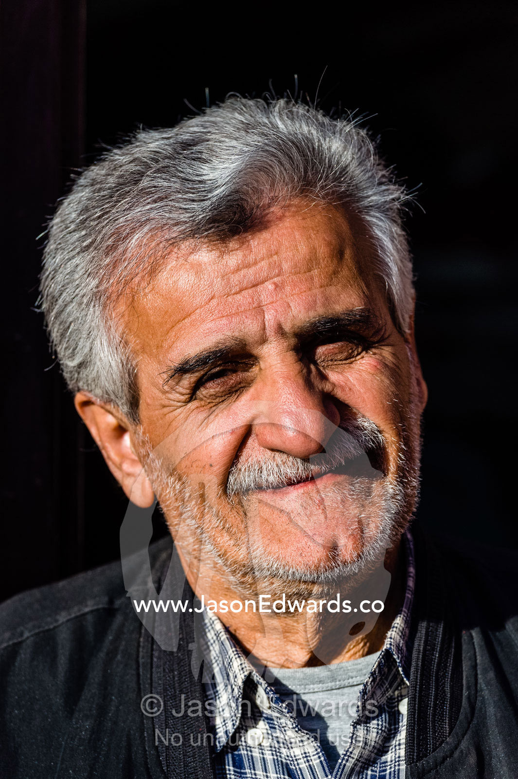 A smiling old gentleman in a mountain village. Abyaneh Village, Abyaneh, Barzrud Rural District, Natanz County, Isfahan Province, Islamic Republic of Iran.
