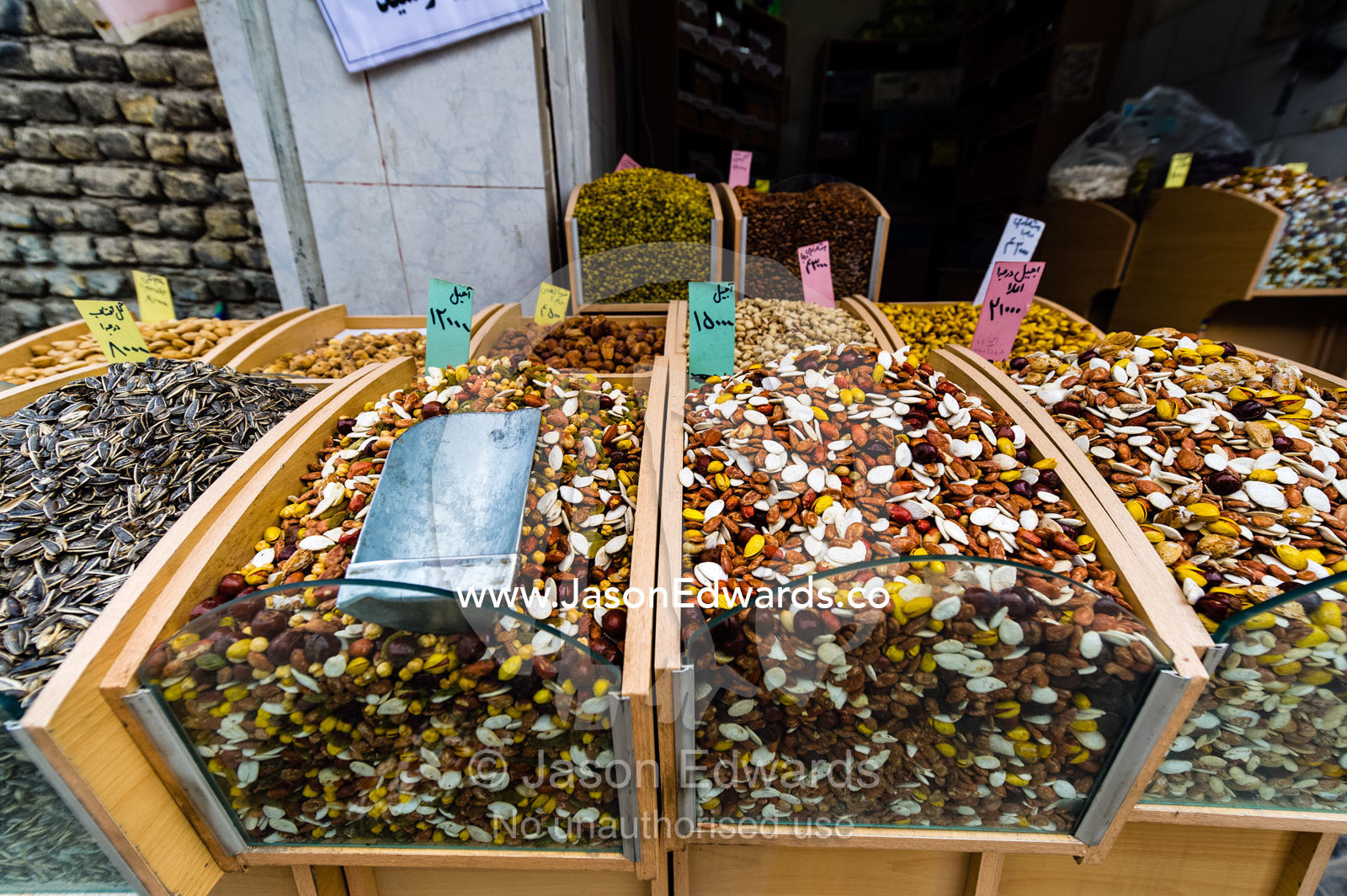 Dry nuts for sale in an open air market. Isfahan, Isfahan Province, Islamic Republic of Iran.
