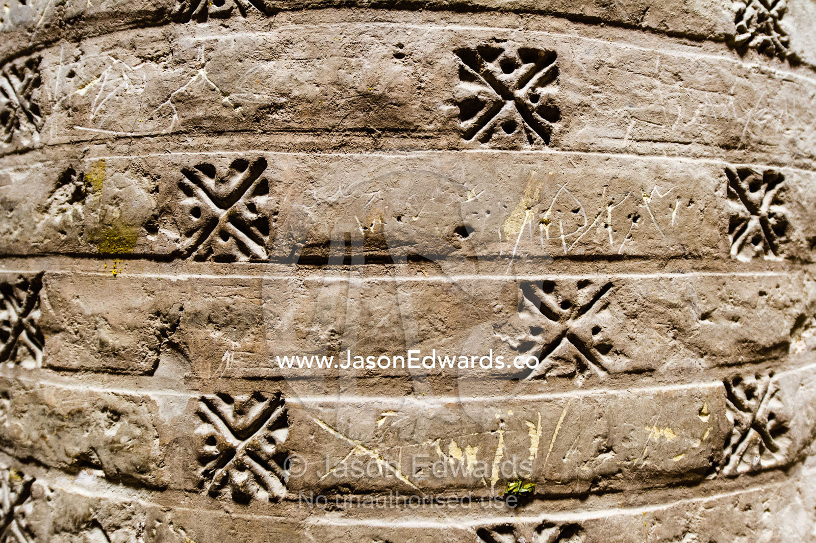Decorations imprinted on the normous stone columns supporting the dome ceilings of the Jameh Mosque. Jameh Mosque of Isfahan, Isfahan, Isfahan Province, Islamic Republic of Iran.