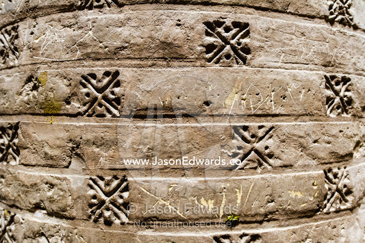 Decorations imprinted on the normous stone columns supporting the dome ceilings of the Jameh Mosque. Jameh Mosque of Isfahan, Isfahan, Isfahan Province, Islamic Republic of Iran.