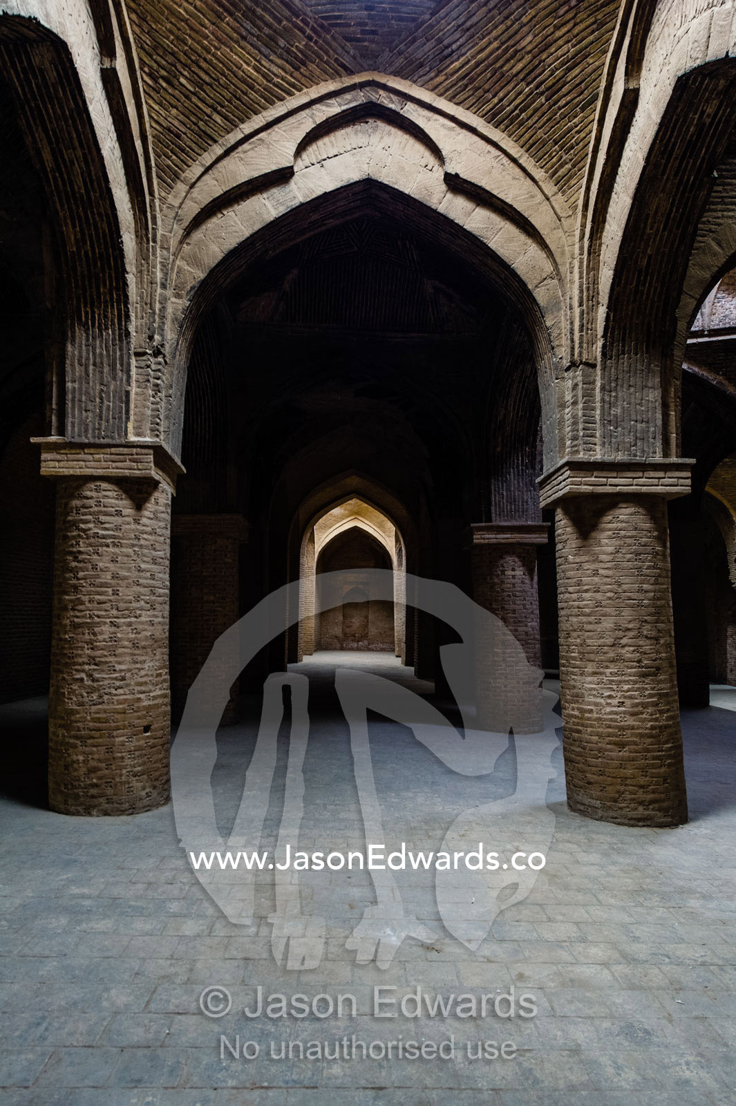 Enormous stone columns of handmade bricks supporting the dome ceilings of the Jameh Mosque. Jameh Mosque of Isfahan, Isfahan, Isfahan Province, Islamic Republic of Iran.