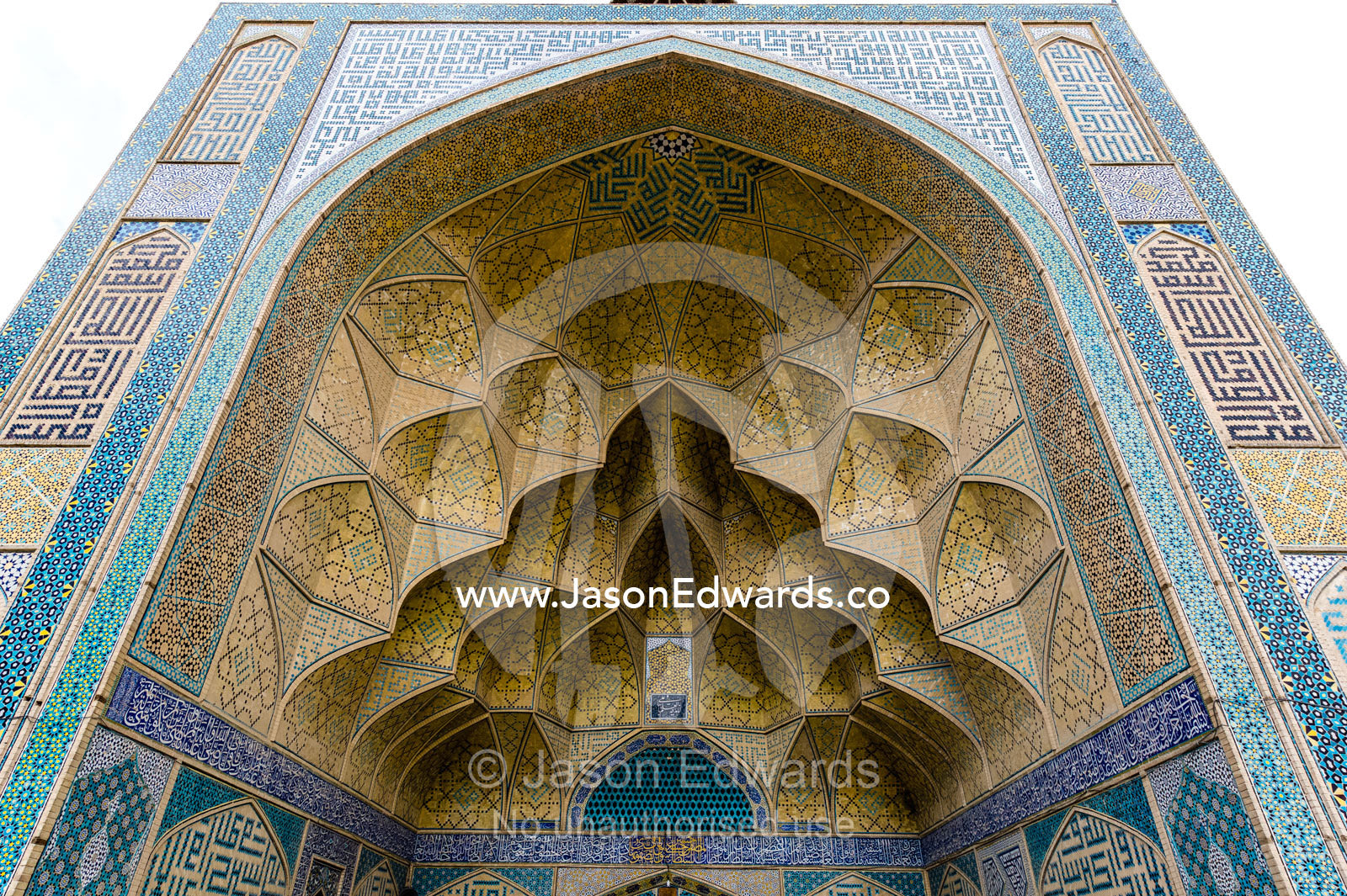 The intricate tiled muqarnas on the vaulted surface of the iwan of Jameh Mosque. Jameh Mosque of Isfahan, Isfahan, Isfahan Province, Islamic Republic of Iran.