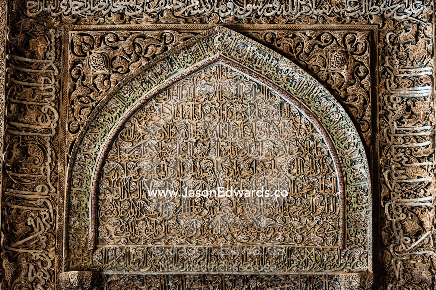 A mix of calligraphy featuring Arabic writing from the Qoran in gypsum stucco and design of flowers. Jameh Mosque of Isfahan, Isfahan, Isfahan Province, Islamic Republic of Iran.
