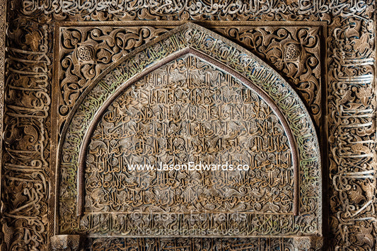 A mix of calligraphy featuring Arabic writing from the Qoran in gypsum stucco and design of flowers. Jameh Mosque of Isfahan, Isfahan, Isfahan Province, Islamic Republic of Iran.