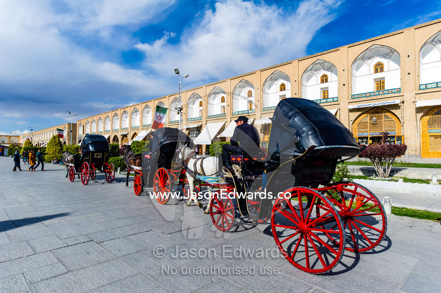 The bright red spokes wheels on horse drawn carriages. Naqsh-e Jahan Square, Isfahan, Isfahan Province, Islamic Republic of Iran.