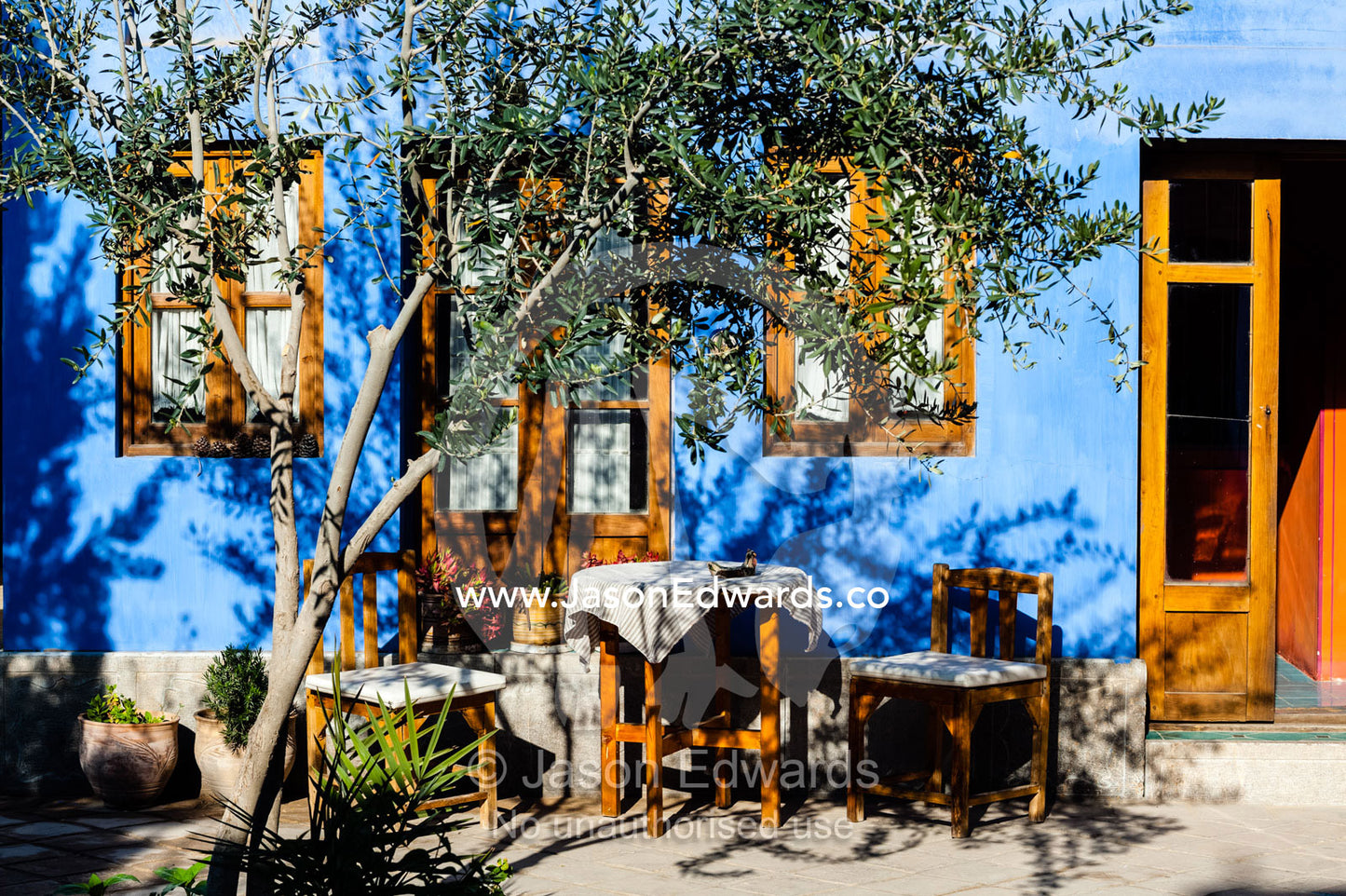 An outdoor setting in a colorful courtyard in a traditional house. Dibai house, Isfahan, Isfahan Province, Islamic Republic of Iran.