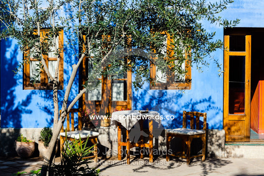 An outdoor setting in a colorful courtyard in a traditional house. Dibai house, Isfahan, Isfahan Province, Islamic Republic of Iran.