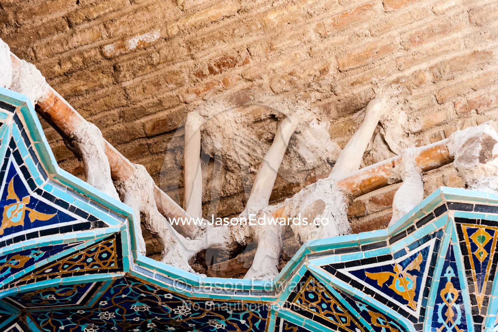 The internal structure of intricate tiled muqarnas on the vaulted surface of the iwan during renovation. Isfahan, Isfahan Province, Islamic Republic of Iran.