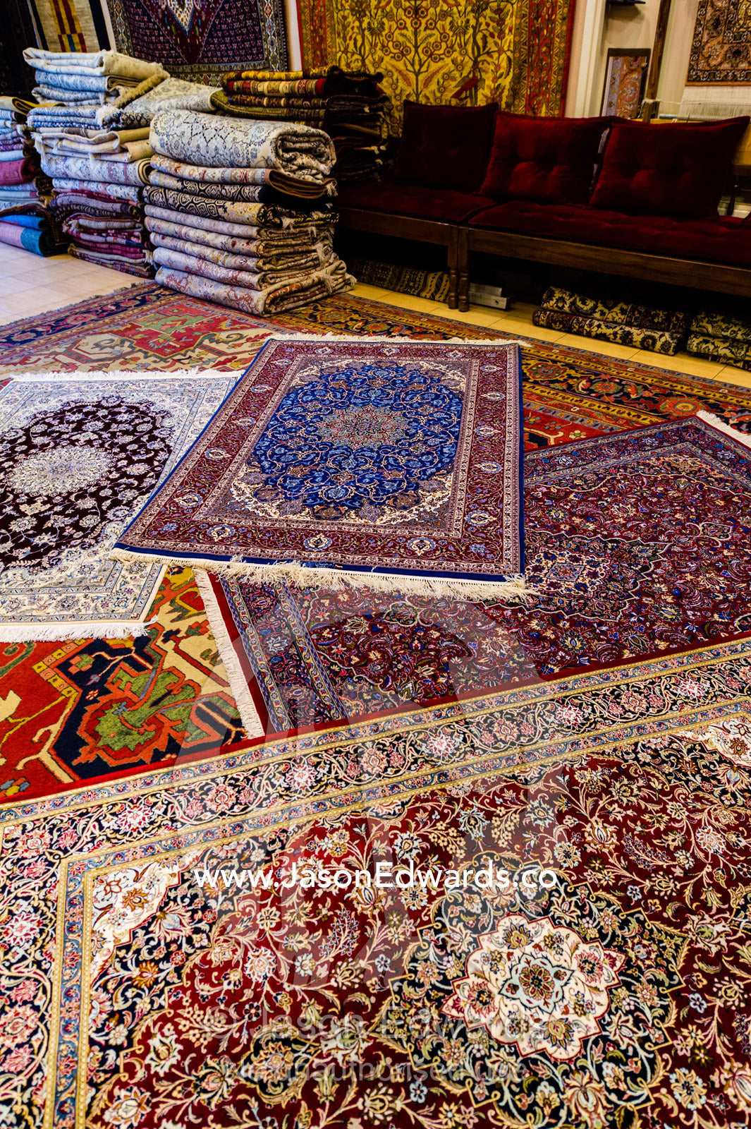 Persian carpets on display for sale in an ancient bazaar. Isfahan, Isfahan Province, Islamic Republic of Iran.