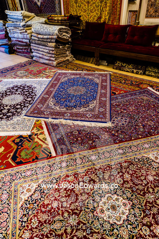 Persian carpets on display for sale in an ancient bazaar. Isfahan, Isfahan Province, Islamic Republic of Iran.