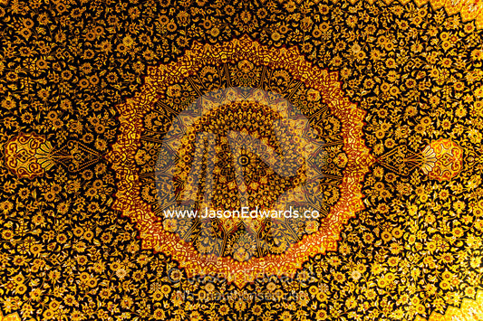 The intricate detail of a golden yellow Persian carpet. Isfahan, Isfahan Province, Islamic Republic of Iran.