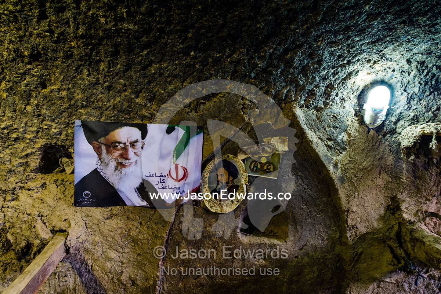 A poster of the Supreme Leader of Iran Ali Khamenei in a cloak weaving workshop. Nain, Nain County, Isfahan Province, Iran.