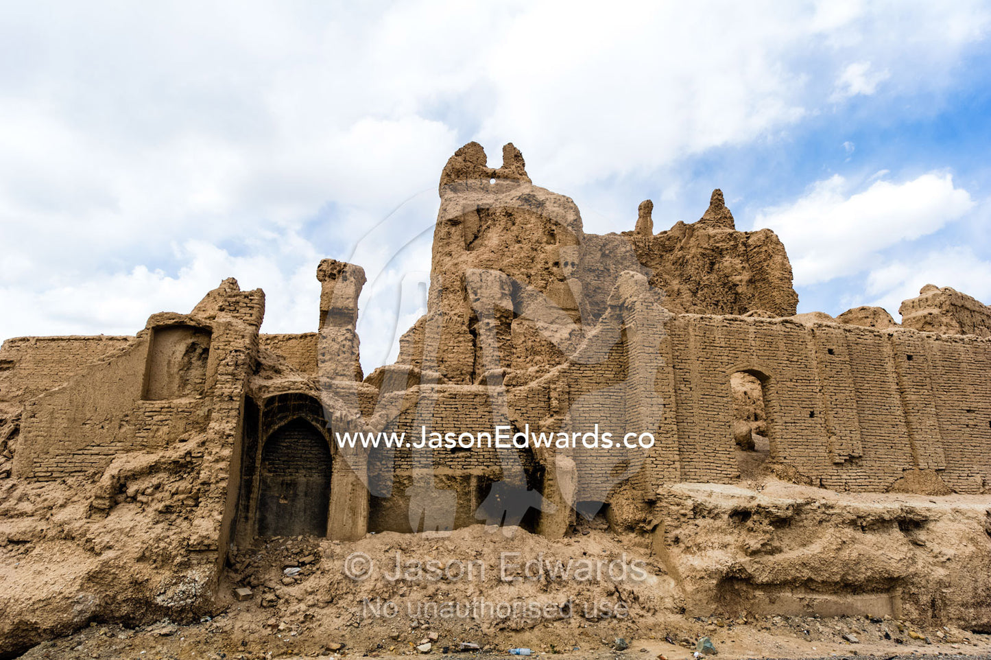 The ruins of an ancient fortress collapsing back into the desert. Nain, Nain County, Isfahan Province, Iran.