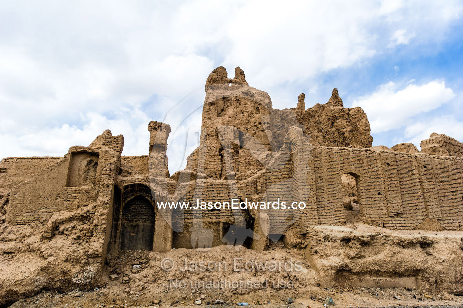 The ruins of an ancient fortress collapsing back into the desert. Nain, Nain County, Isfahan Province, Iran.