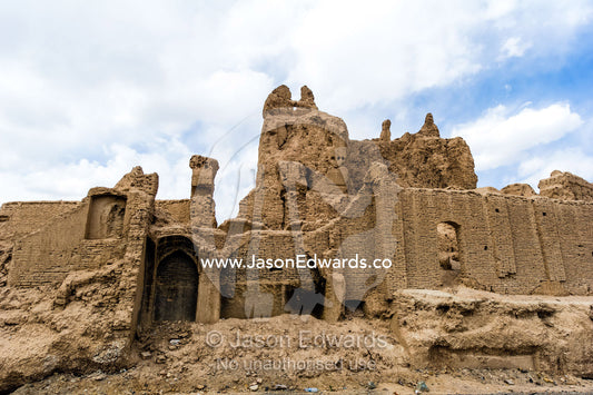 The ruins of an ancient fortress collapsing back into the desert. Nain, Nain County, Isfahan Province, Iran.